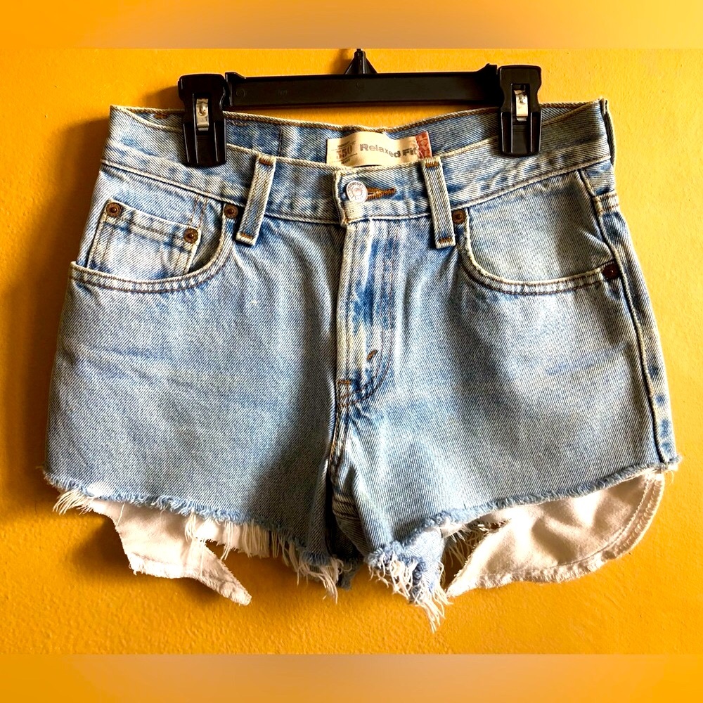 Vintage Levi’s relaxed fit denim distressed shorts